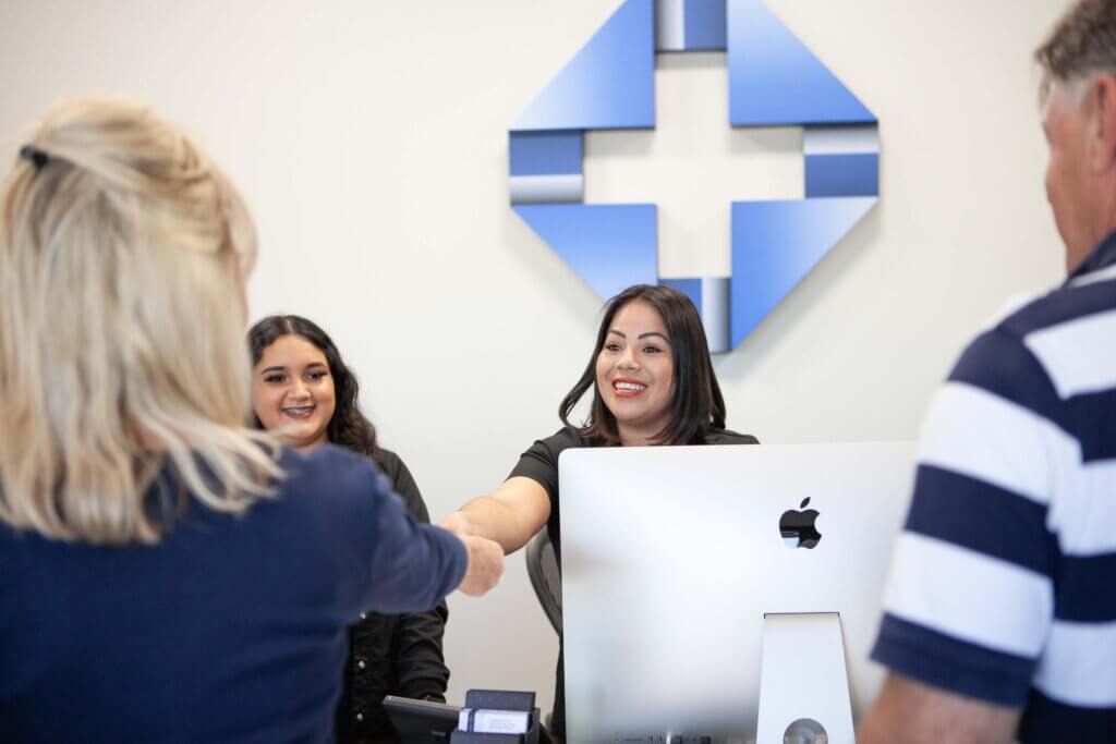Medical assistants welcoming patients into Immediate Care Arizona
