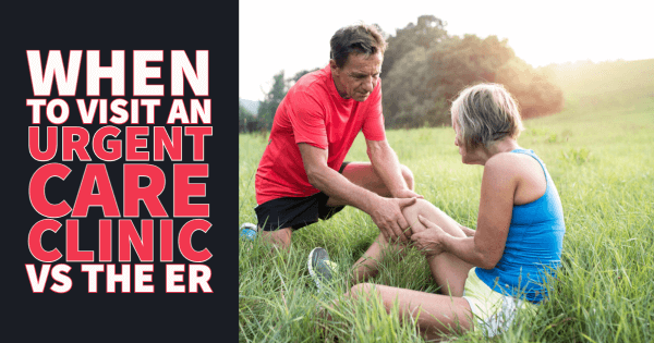 A female runner sitting on the ground with a hurt knee being helped by her male friend