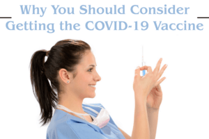 A doctor preparing a needle to give a patient a vaccination