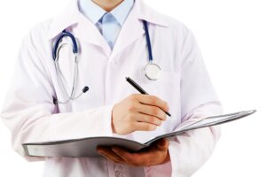 Patients medical notes being updated by a doctor