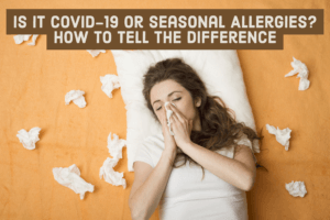 A woman blowing her nose surrounded by used tissues